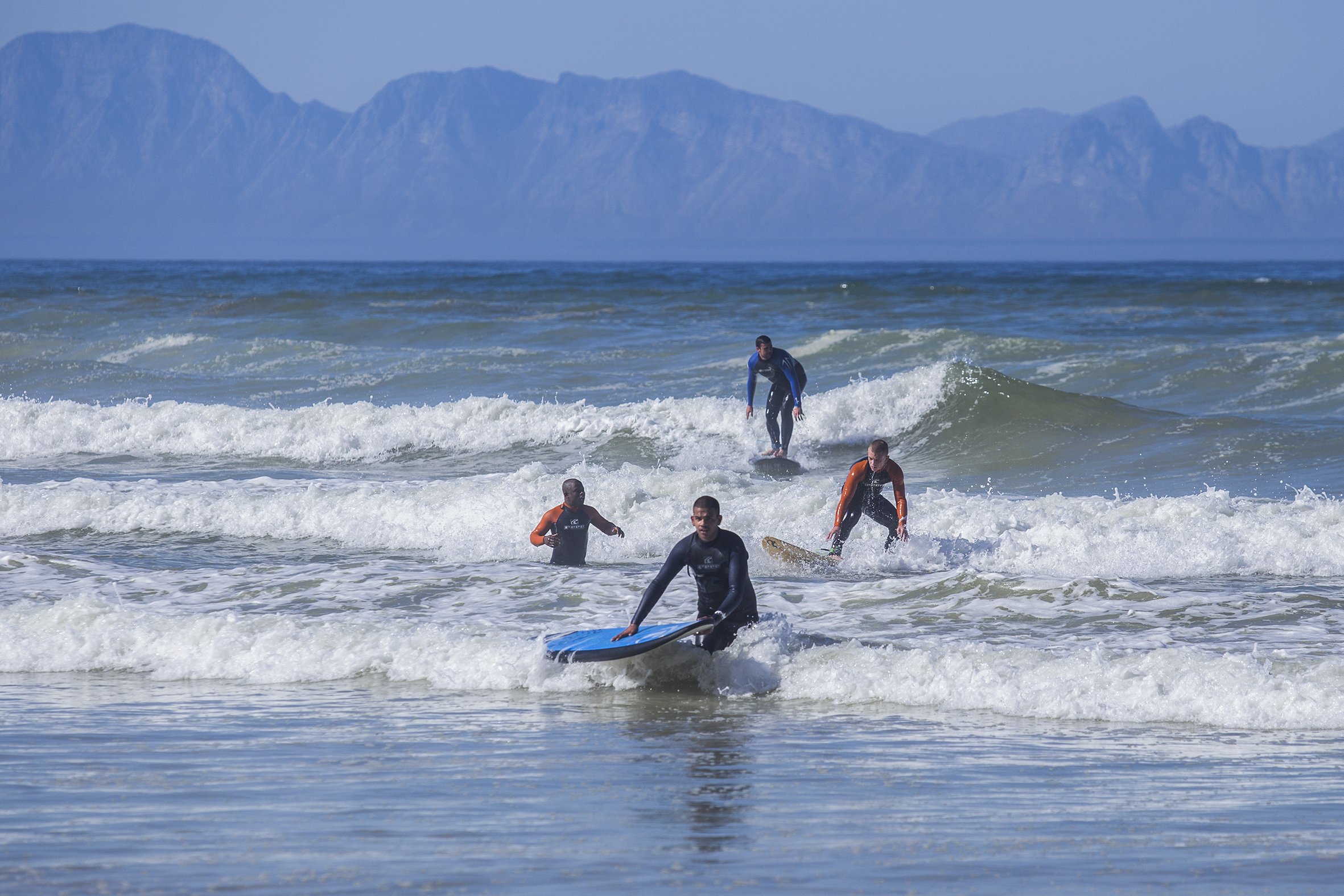 Kids from the Ottery Youth Care Centre attend a surfing class at Muizenberg Beach in Cape Town. April 2017.