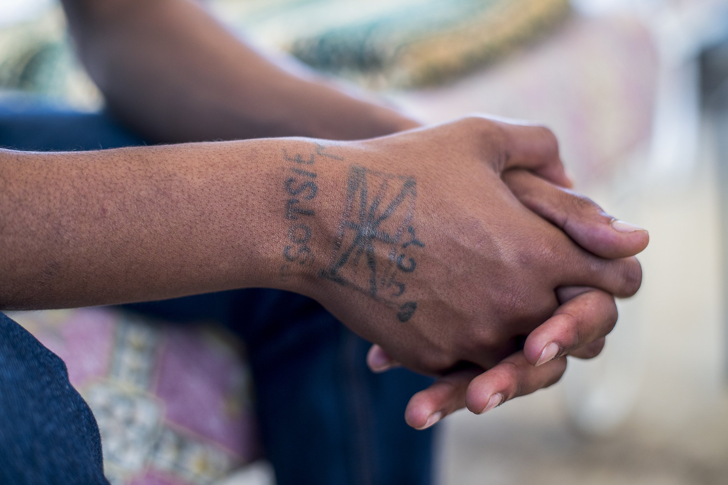 'Tsotsi' meaning gangster or criminal is seen on the hand of one of the past students from the Ottery Youth Care Centre. April 2017.