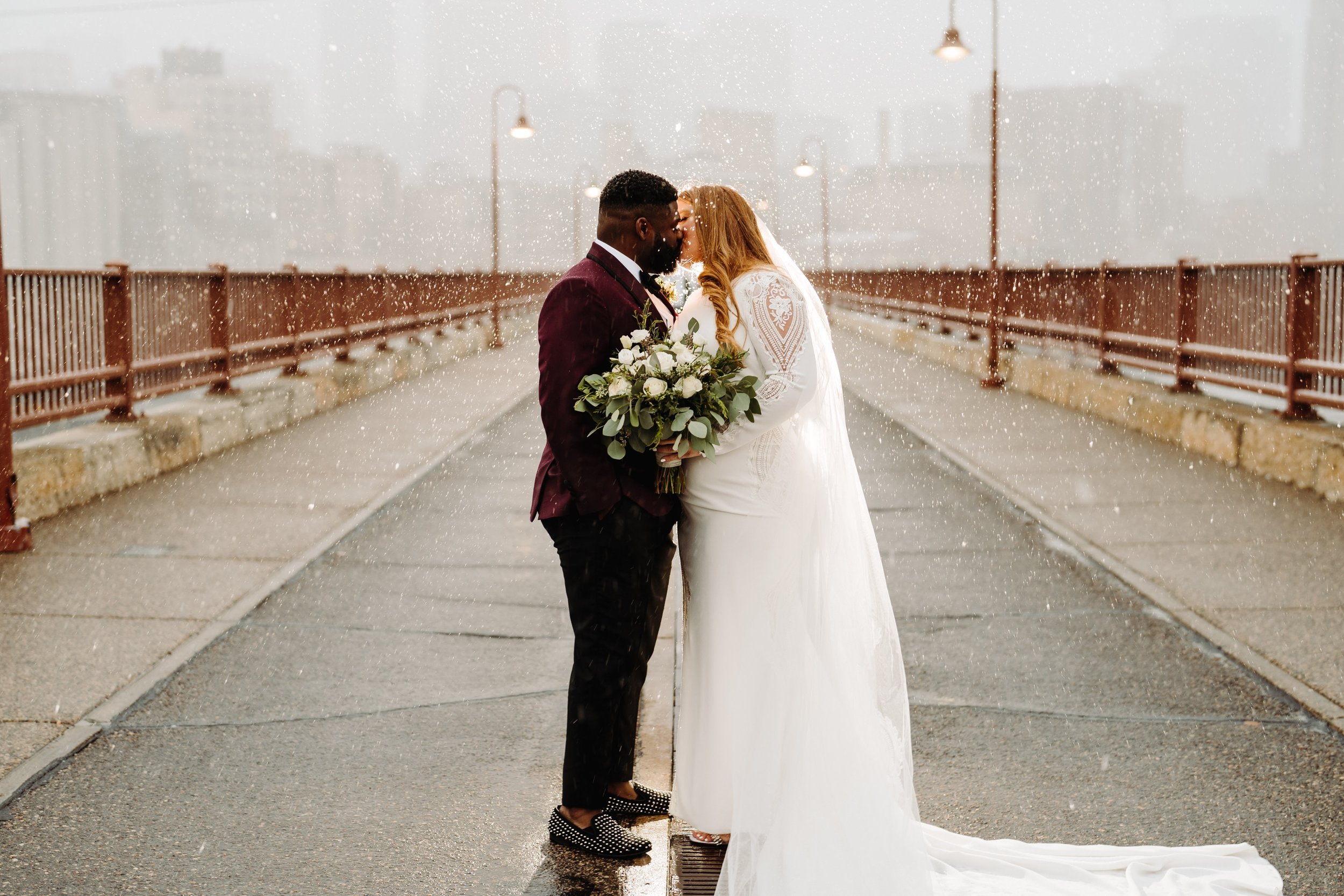 037_Winter bride and groom photos by Stone Arch Bridge in Minneapolis, Minnesota..jpg