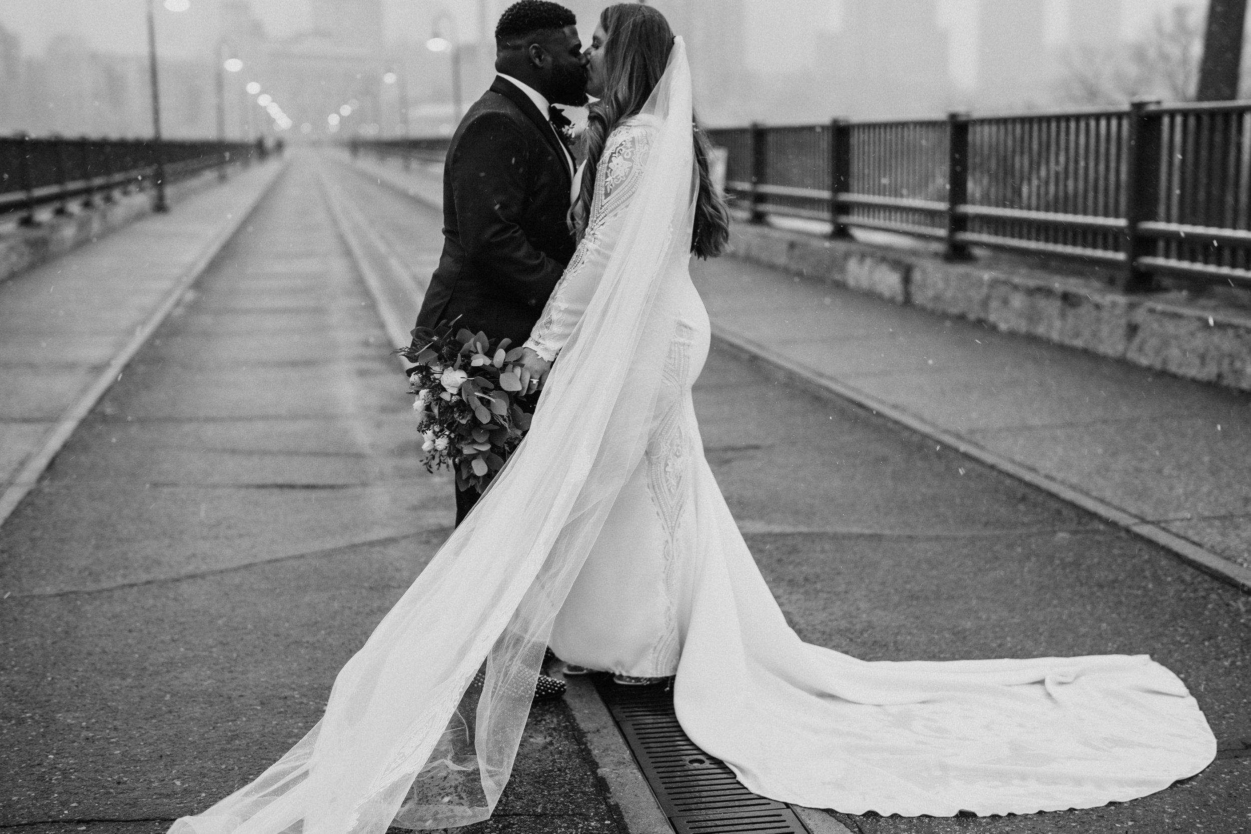 039_Winter bride and groom photos by Stone Arch Bridge in Minneapolis, Minnesota..jpg