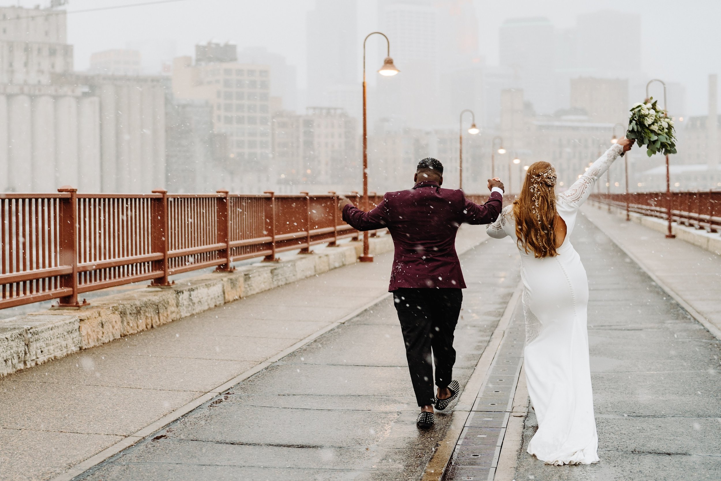 040_Winter bride and groom photos by Stone Arch Bridge in Minneapolis, Minnesota..jpg