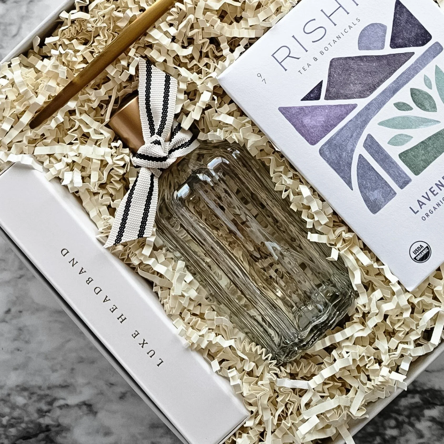 Serenity gift box featuring soothing tea, eco-friendly luxe headband, and fresh SALT room spray for a peaceful, spa-like unwind.