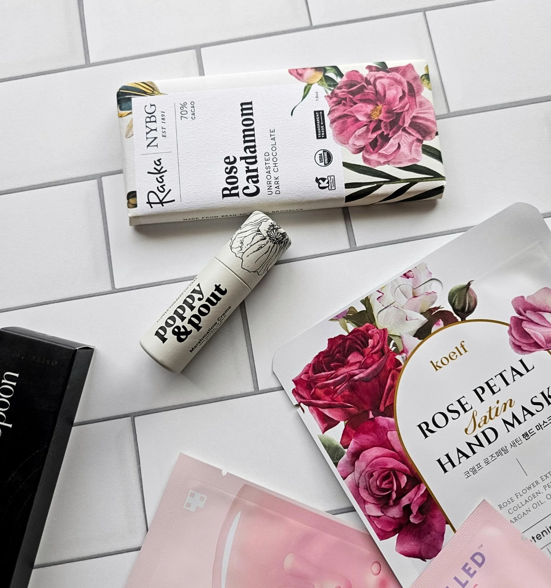 Galentine's Day self‑care gift bag with luxury skincare, rose eye gels, chocolate, lip balm, and a gold bar spoon.