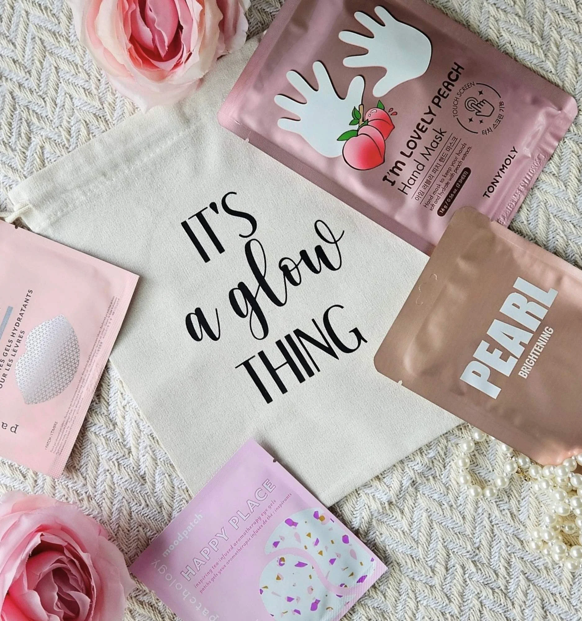 Eco‑friendly cotton gift bag filled with face, hand, eye, and lip masks for a glowing self‑care moment.