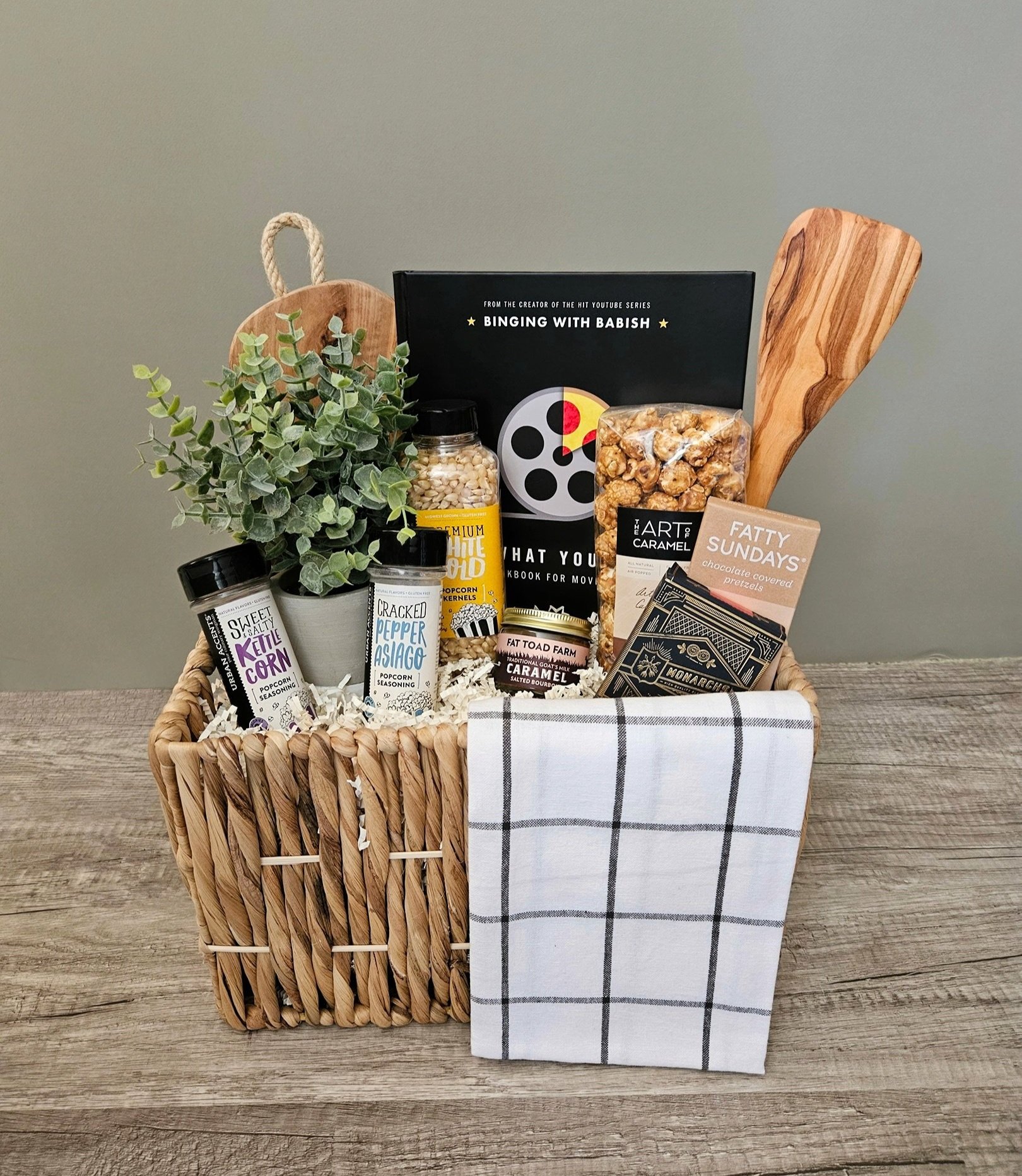 movie themed gift with a fun movie cookbook, popcorn seasoning, flavored popcorns, and caramel treats