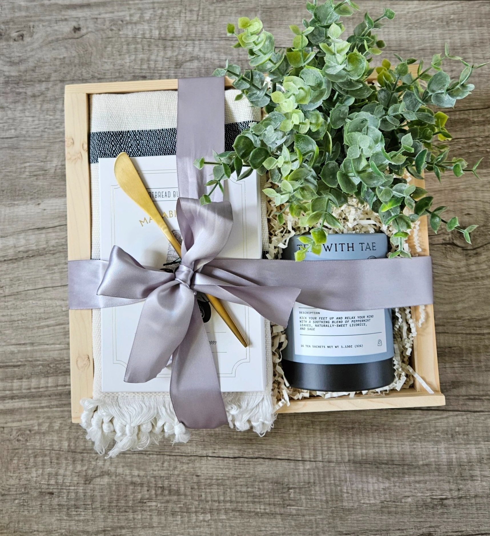 a gift with calming tea, shortbread cookies, and a beautiful hand towel for the new homeowner