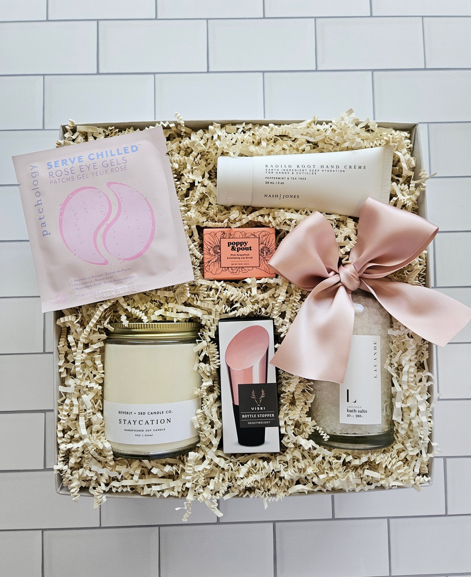 spa gift box with luxury bath salts, lip scrub, candle, and revitalizing eye gels