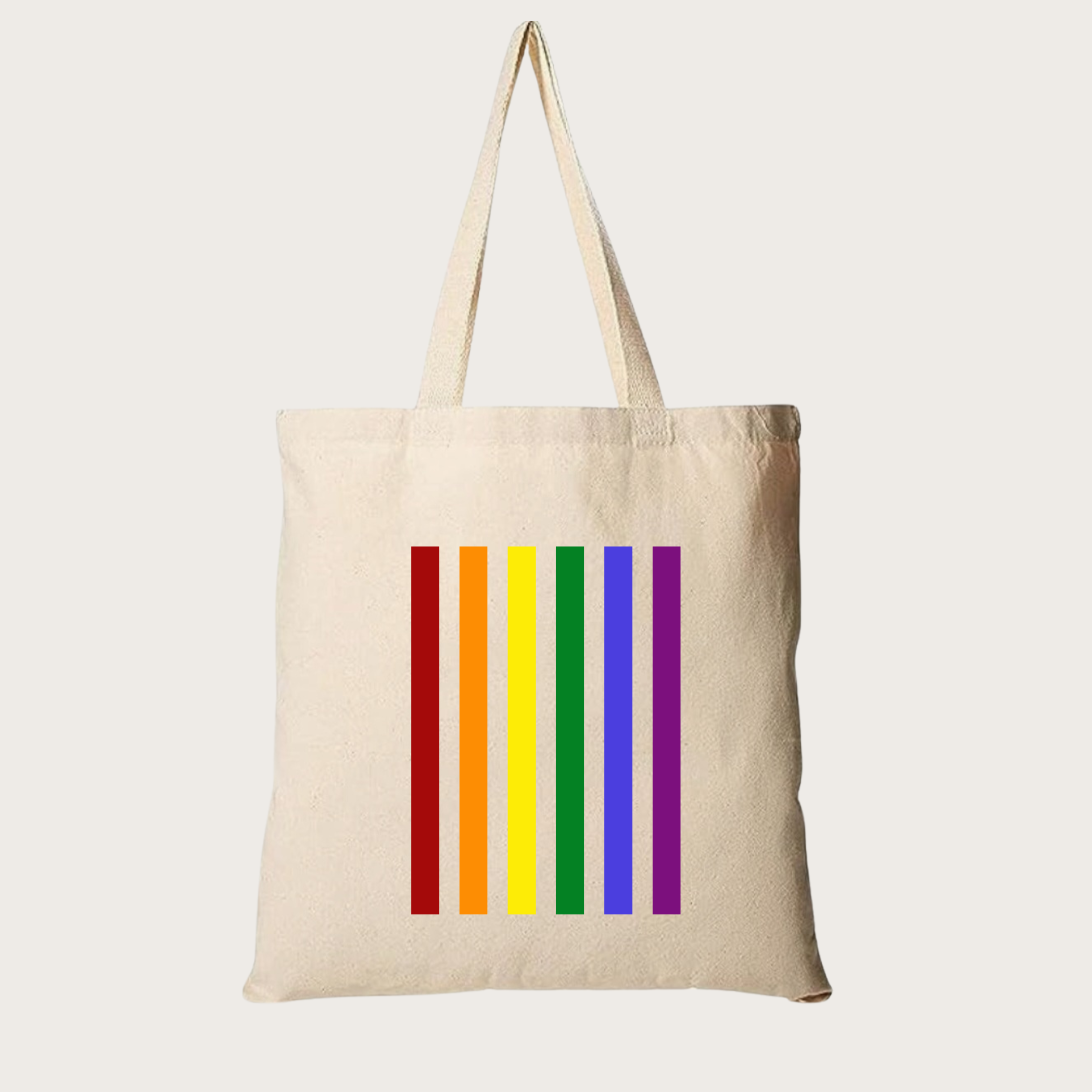 Natural-colored eco‑friendly tote bag with bold vertical rainbow stripes, celebrating LGBTQ+ Pride, equality, and inclusion.