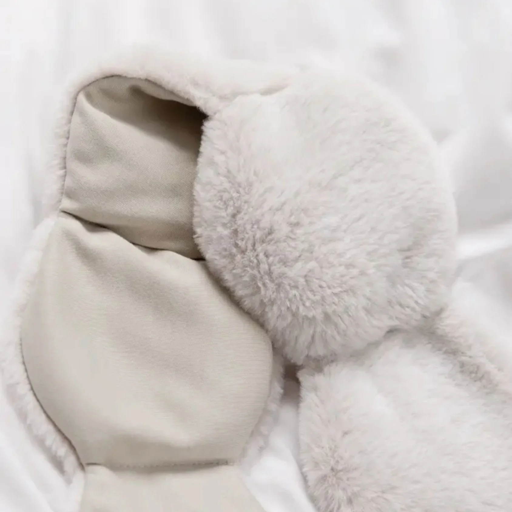New limited edition reversible weighted eye mask with plush and cotton sides, perfect for winter wellness and gifting.