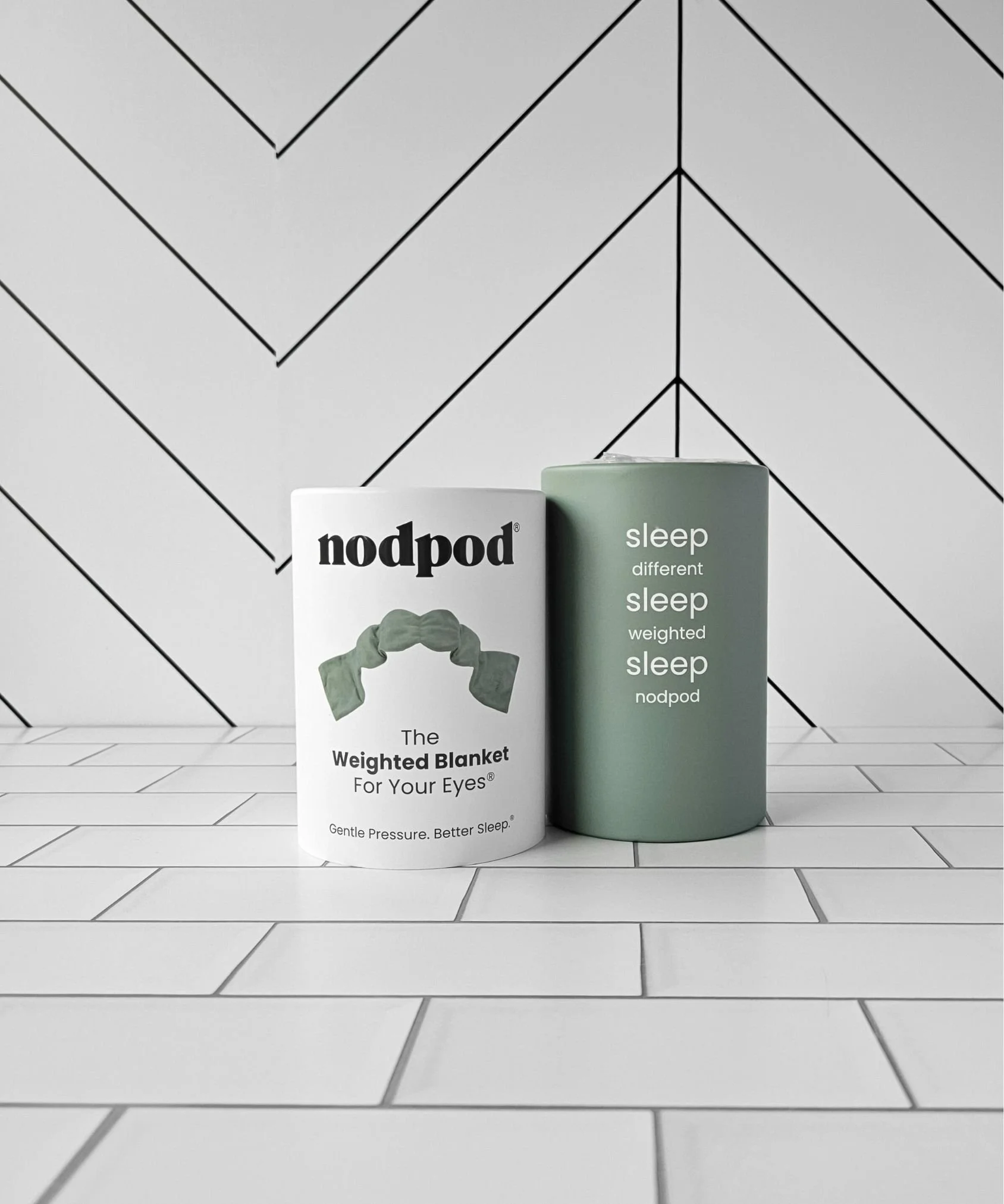 Sage Nodpod weighted eye mask with strap‑free deep‑touch pressure, easing headaches and promoting calm sleep with eco‑friendly cotton, microfleece, and BPA‑free beads.