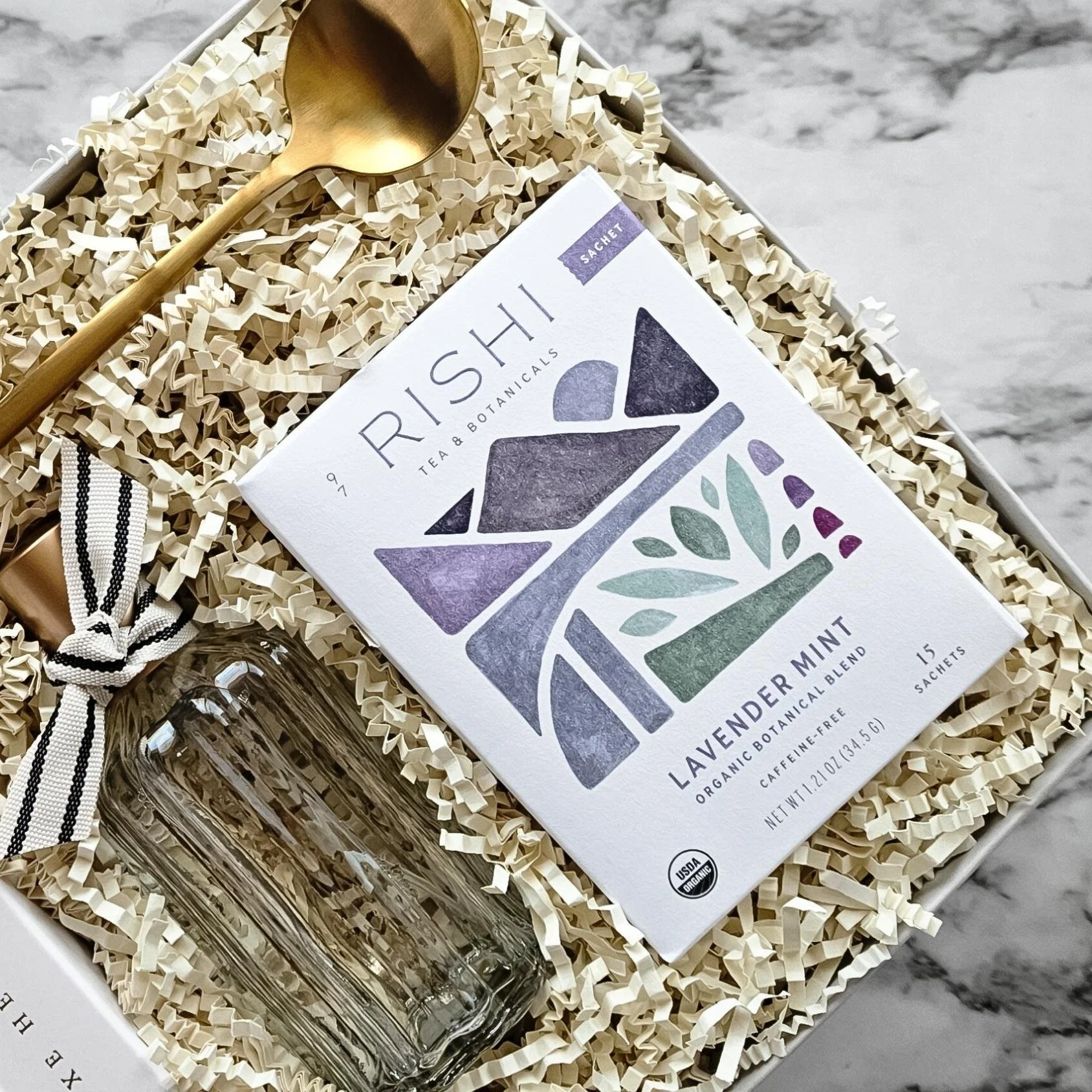 Neutral-toned relaxation gift box with calming tea, luxe headband, and SALT room spray for a soft, coastal-clean moment of calm.