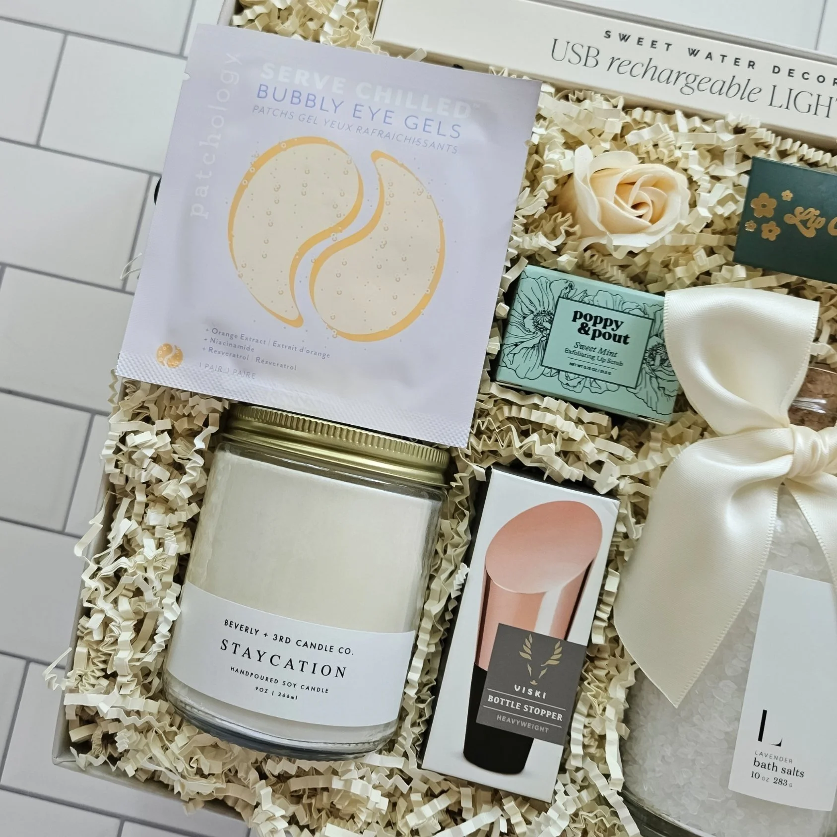 Spa-inspired gift set with candle, eye patches, and bath salts—an ideal anniversary or bridal gift for women who love to unwind