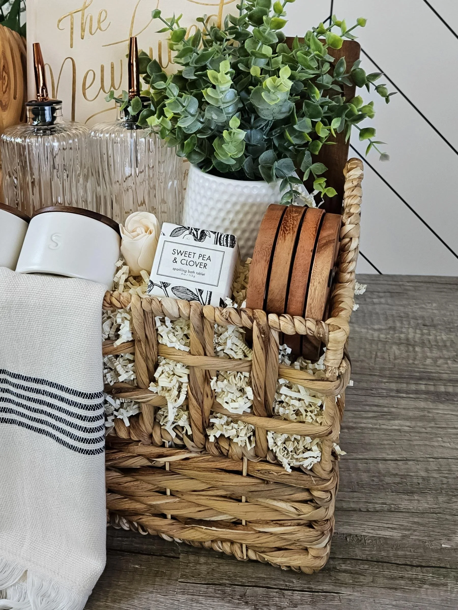 A romantic newlywed gift basket designed for shared moments, with soft neutral hues, artisanal wood details, and timeless home essentials to celebrate the newlywed couple.