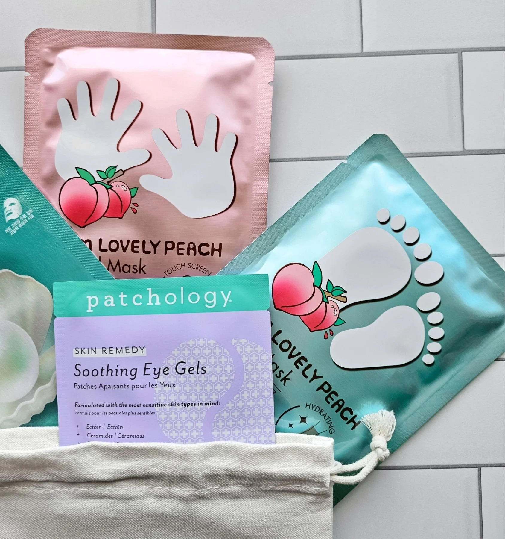 Spa‑day sheet mask set including eye gels, peach hand and foot masks, and a brightening pearl mask for hydration and self‑care.