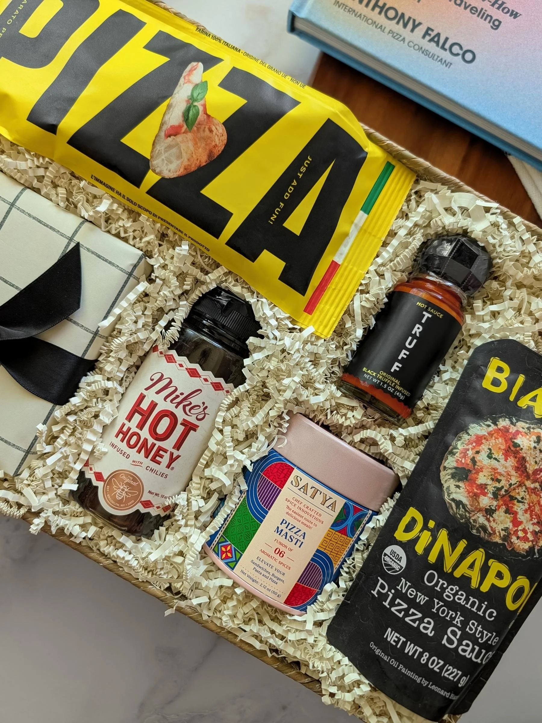 Curated Pizza Night gift set with premium pizza ingredients, hot honey, truff sauce, pizza seasoning, Italian pizza dough, pizza cutter, and more for a fun family night in.