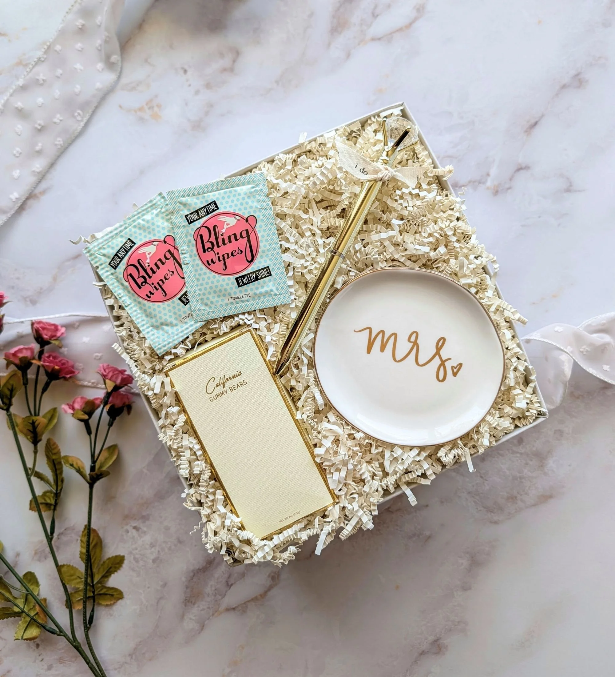 Luxury petite engagement gift box with ring dish, wedding checklist book, luxe gummy bears, and bling wipes for celebrating a bride‑to‑be.