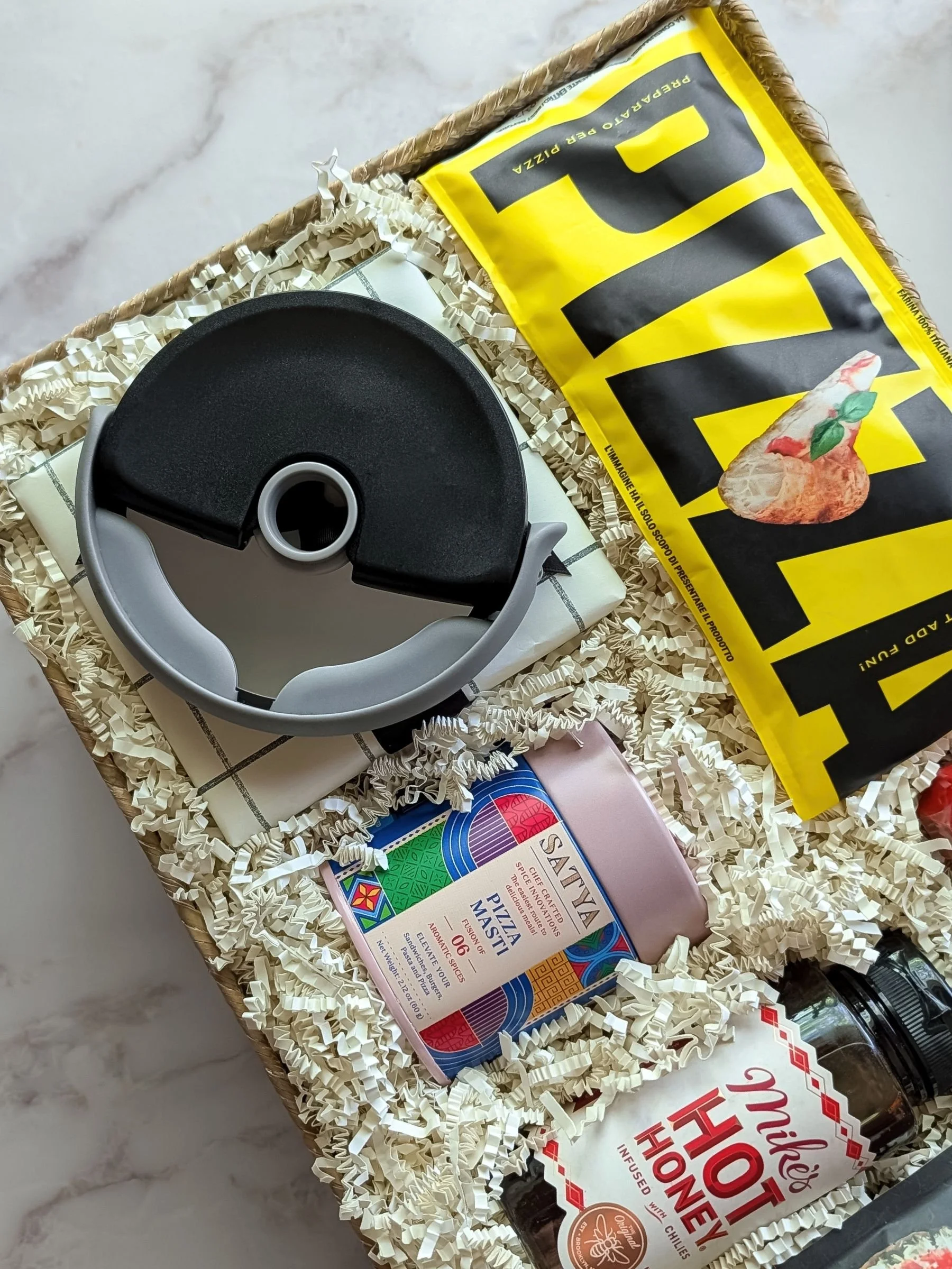 Vibrant artisan Pizza Night gift box featuring gourmet pizza seasoning, hot honey, pizza cutter, authentic pizza crust dough.