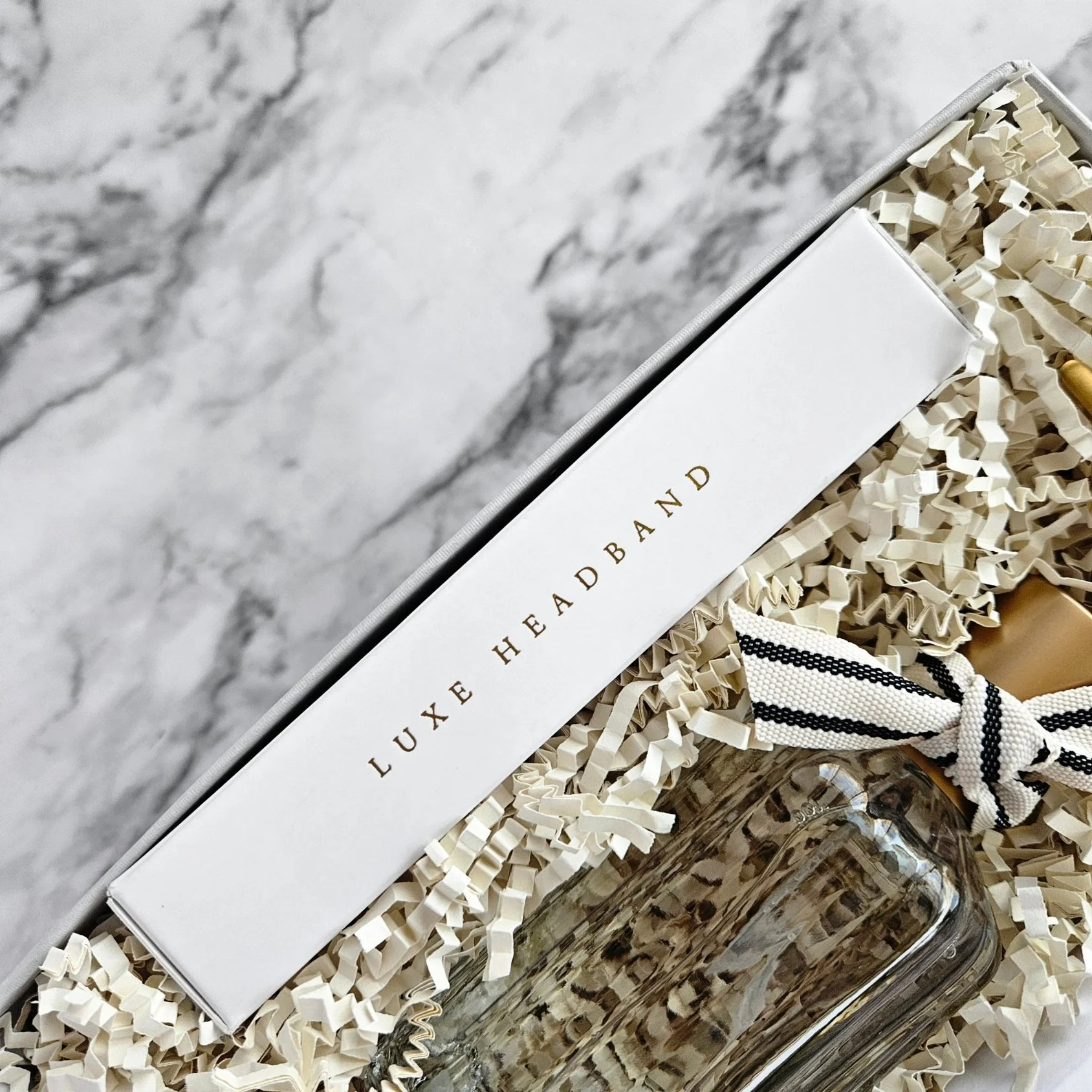 Serenity gift box featuring eco-friendly luxe bamboo eco-friendly headband, calming tea, and fresh room spray for a peaceful, spa-like unwind.