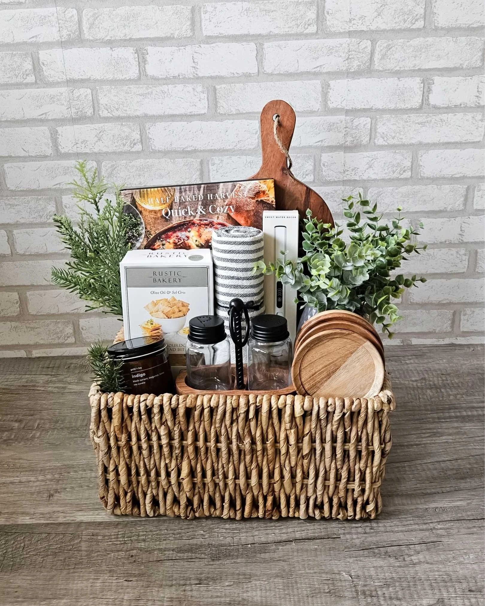 Rustic Harvest gift basket with cookbook, Indigo candle, tea towel, rechargeable lighter, wood accents, and gourmet flatbreads