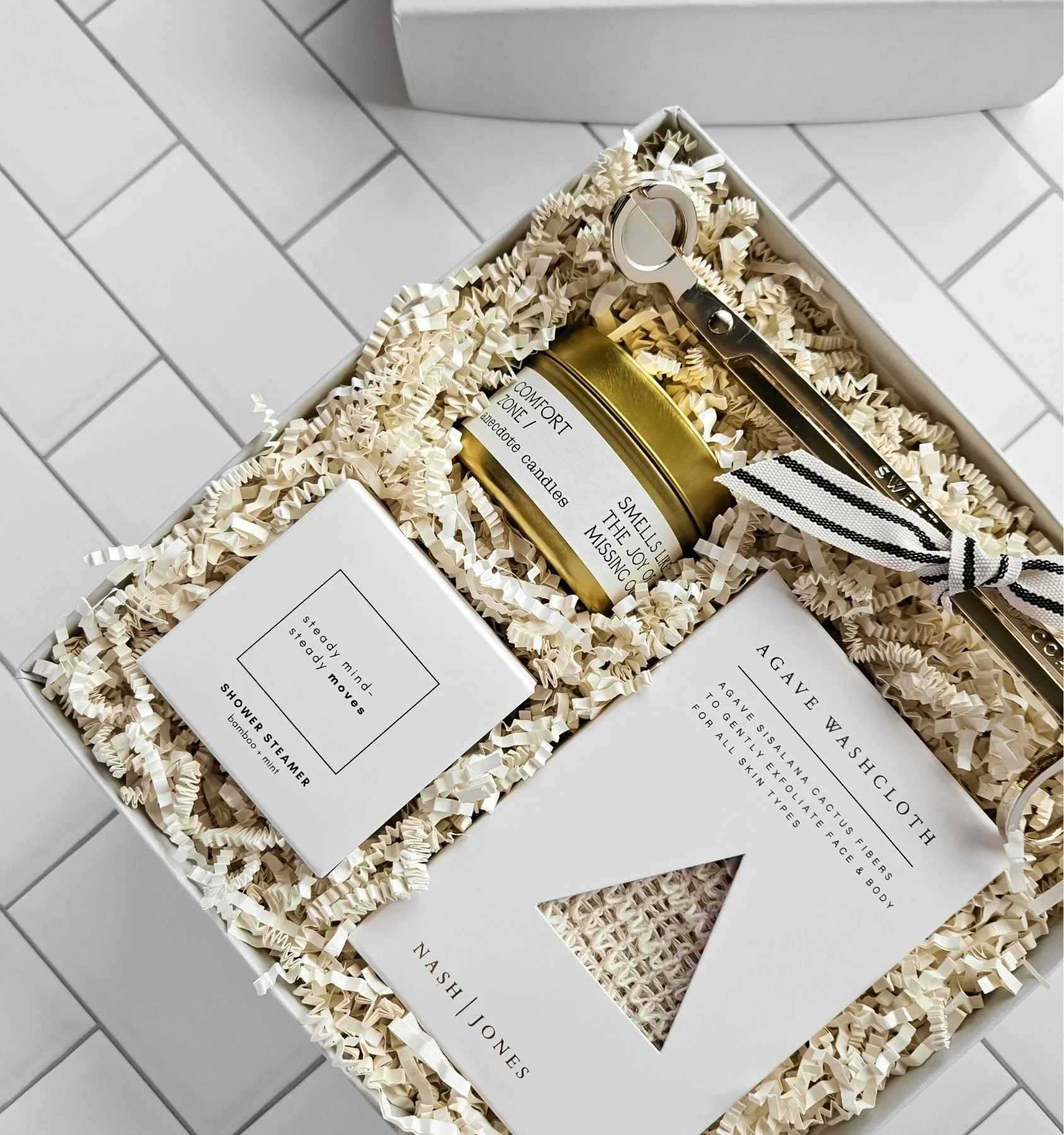 Mini spa gift box with agave washcloth, bamboo mint shower steamer, and Comfort Zone candle for a relaxing self‑care moment.