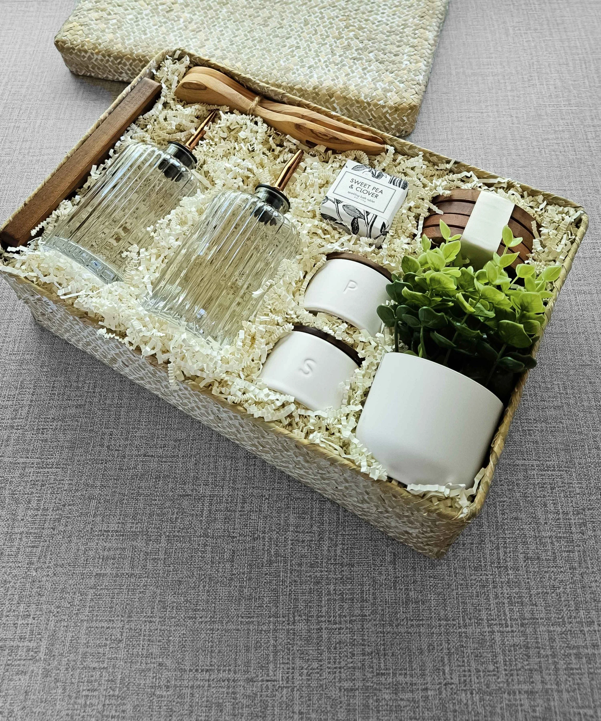 Neutral-toned wedding gift basket featuring artisanal wood accents, soft aesthetic hues, and refined home essentials for the newlywed couple