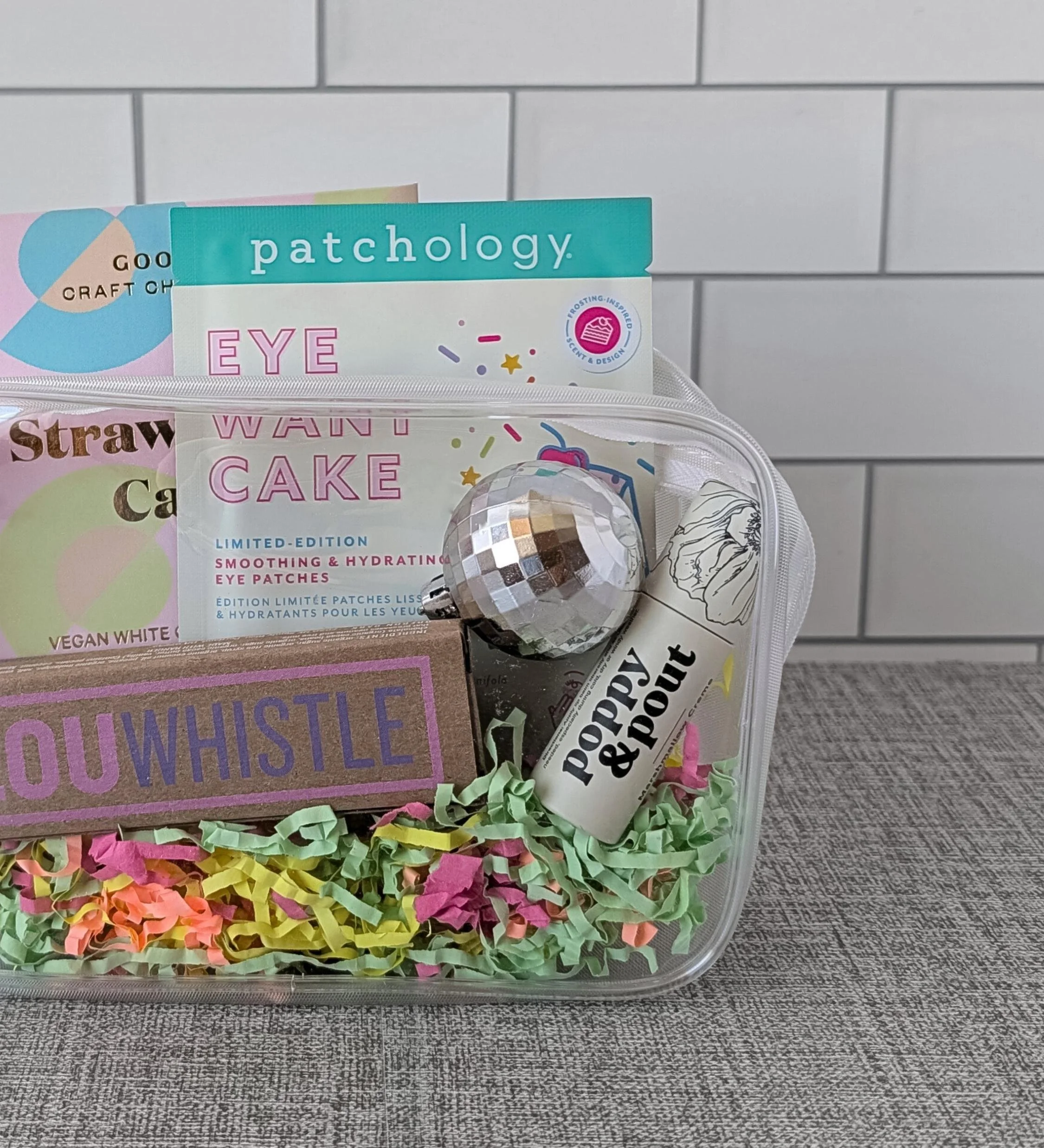 Modern birthday self‑care gift bag with colorful treats and a mini disco ball for a cheerful celebration.