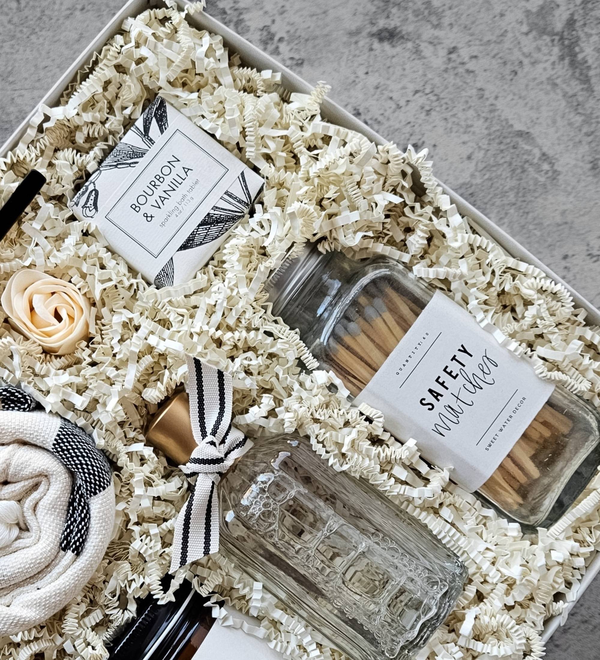 Premium housewarming gift set with candle, matches, Turkish towel, room spray, and relaxing bath essentials.