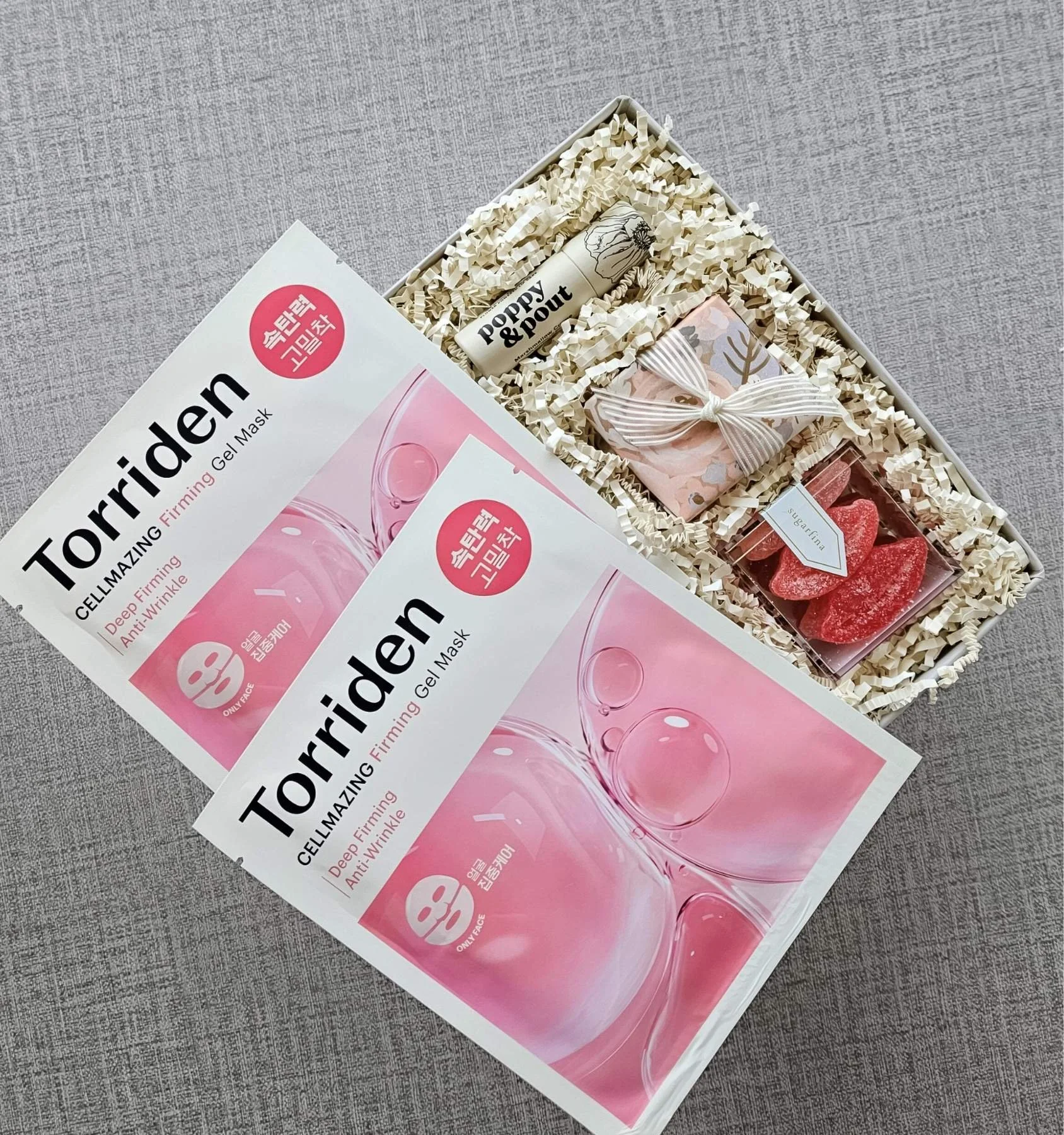Valentine’s Day skincare gift box with hydrating lip care, Torriden Cellmazing masks, and sweet lip‑shaped gummies.