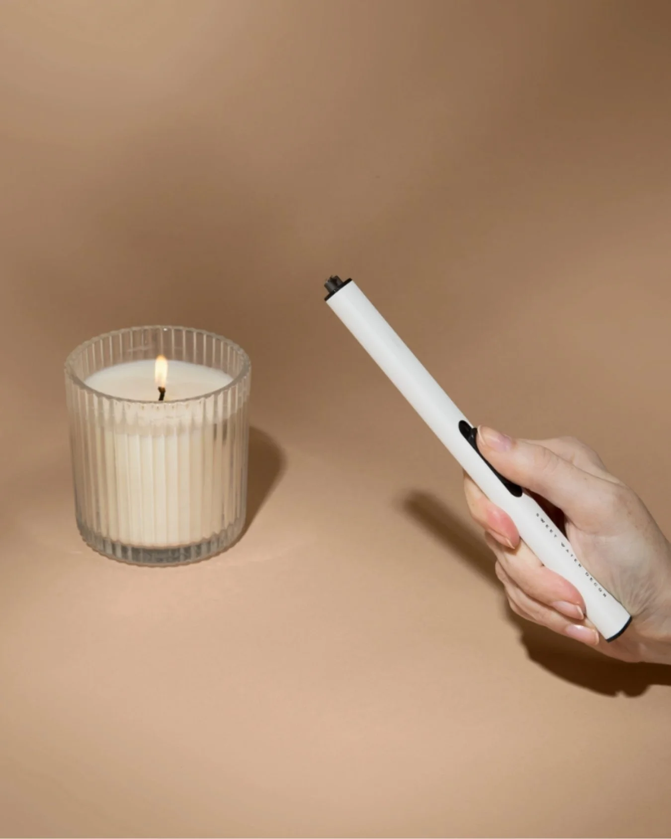 White USB rechargeable arc lighter by Sweet Water Decor with sleek design, ideal for candles and gifting