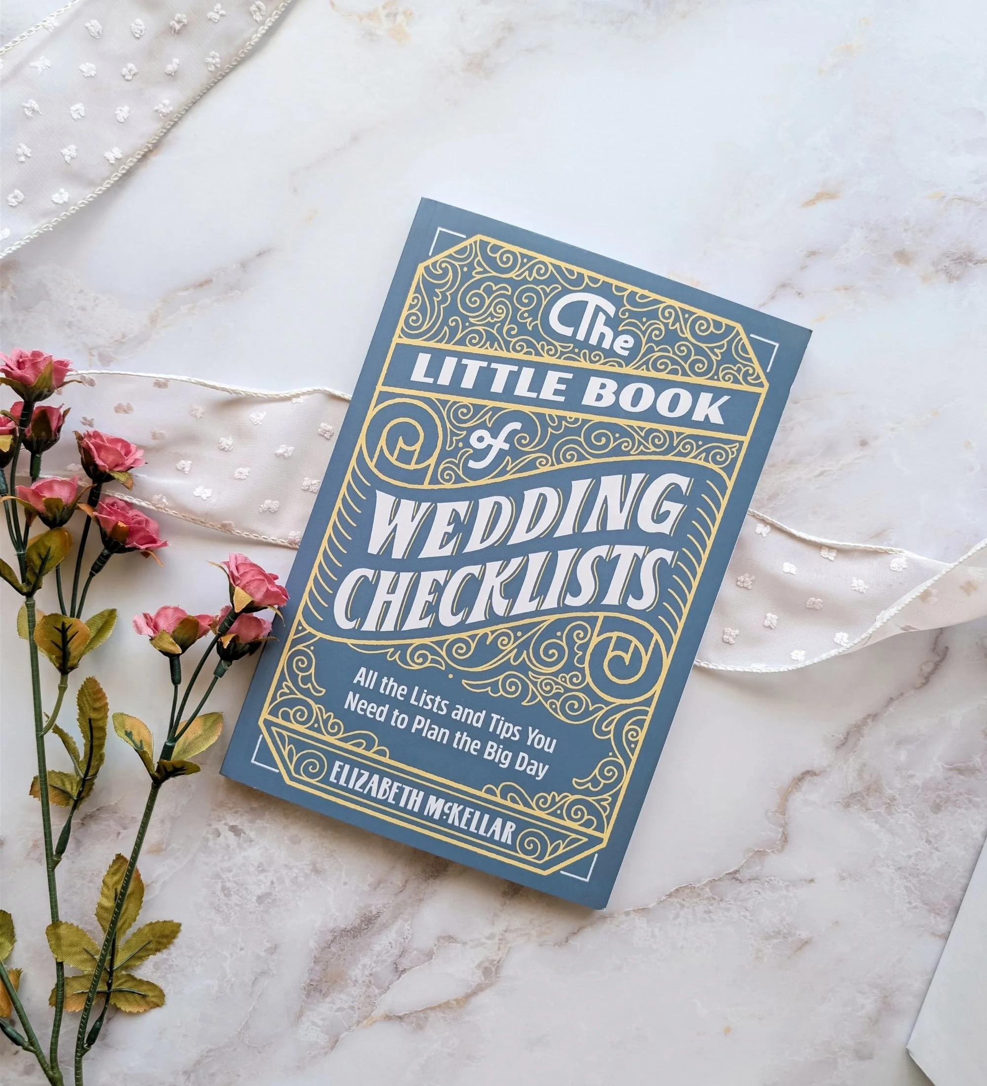 The Little Book of Wedding Checklists displayed as a modern bridal planning essential for the bride‑to‑be.