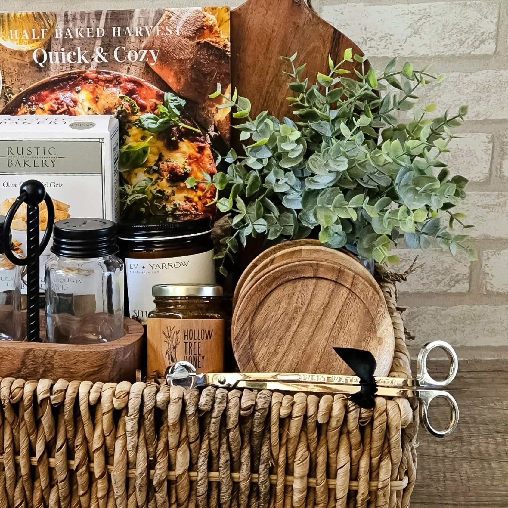 A rustic cozy gift basket with industrial and wood accents. Includes gourmet treats, smoked vanilla candle, and more.
