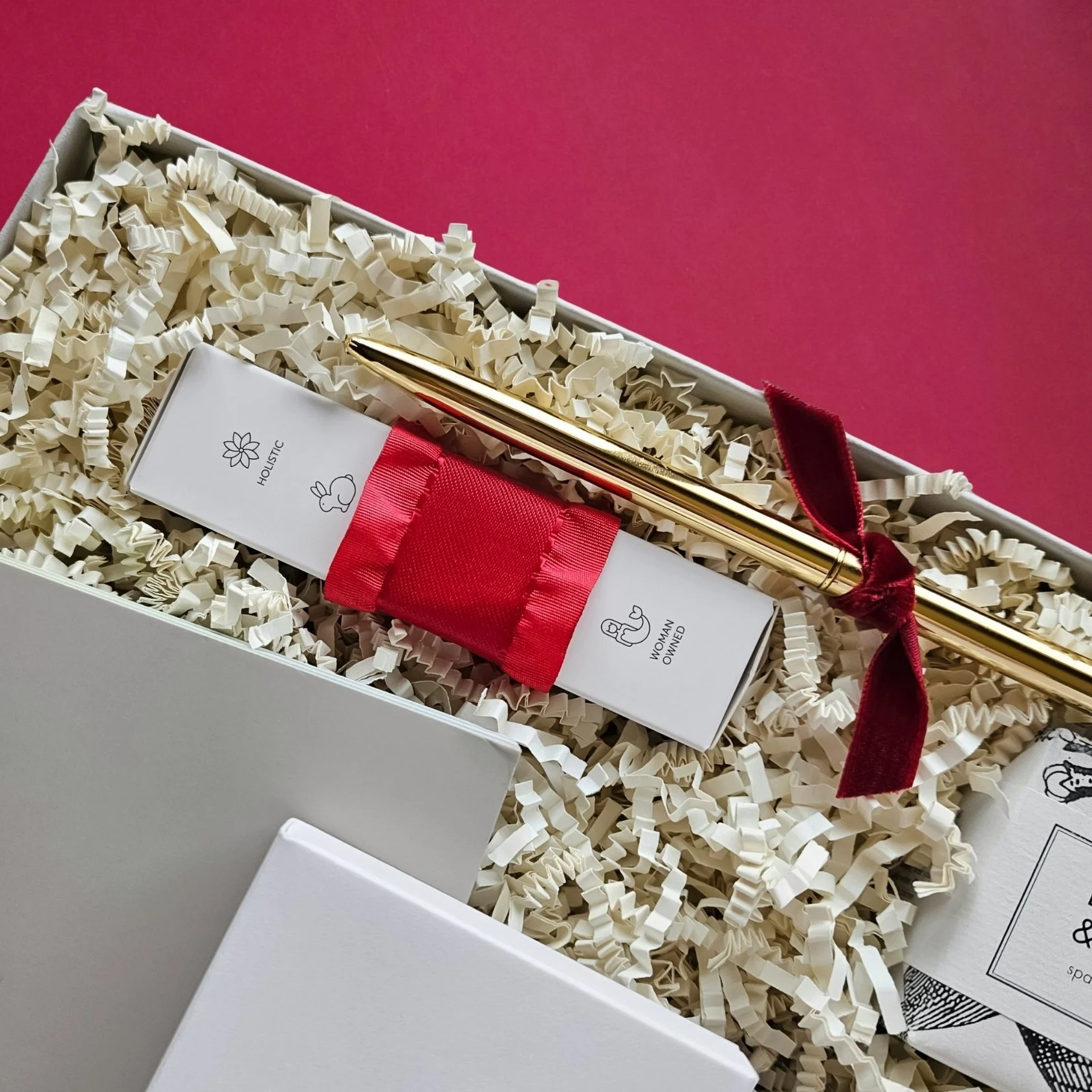 Romantic Valentine’s gift box featuring a red weighted eye mask, bourbon vanilla bath tablet, K+M chocolate bar, and Atticus poetry book.