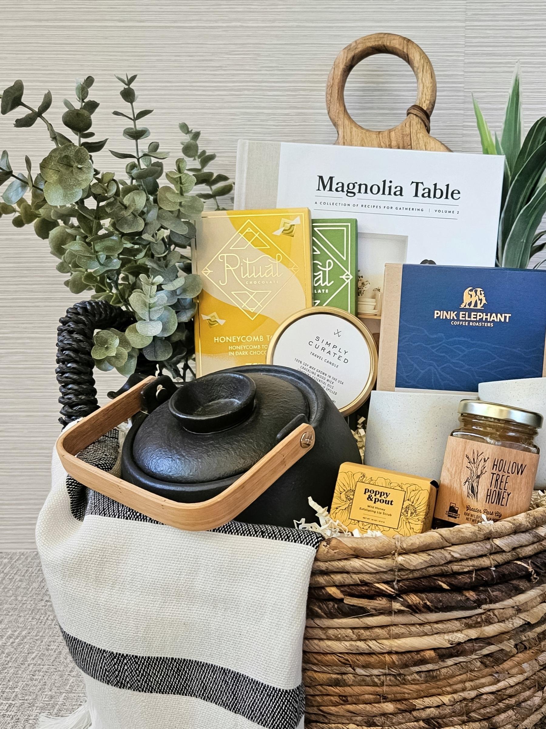 Elegant, eco‑minded gift basket with artisan kitchenware, gourmet chocolate, wildflower honey, coffee, and thoughtful self‑care essentials.