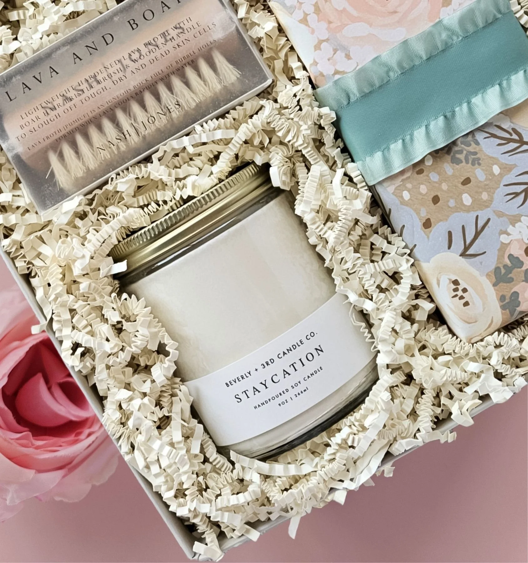Golden Hour self‑care gift box including scented candle, exfoliating brush, and artisan vanilla shortbread in floral packaging