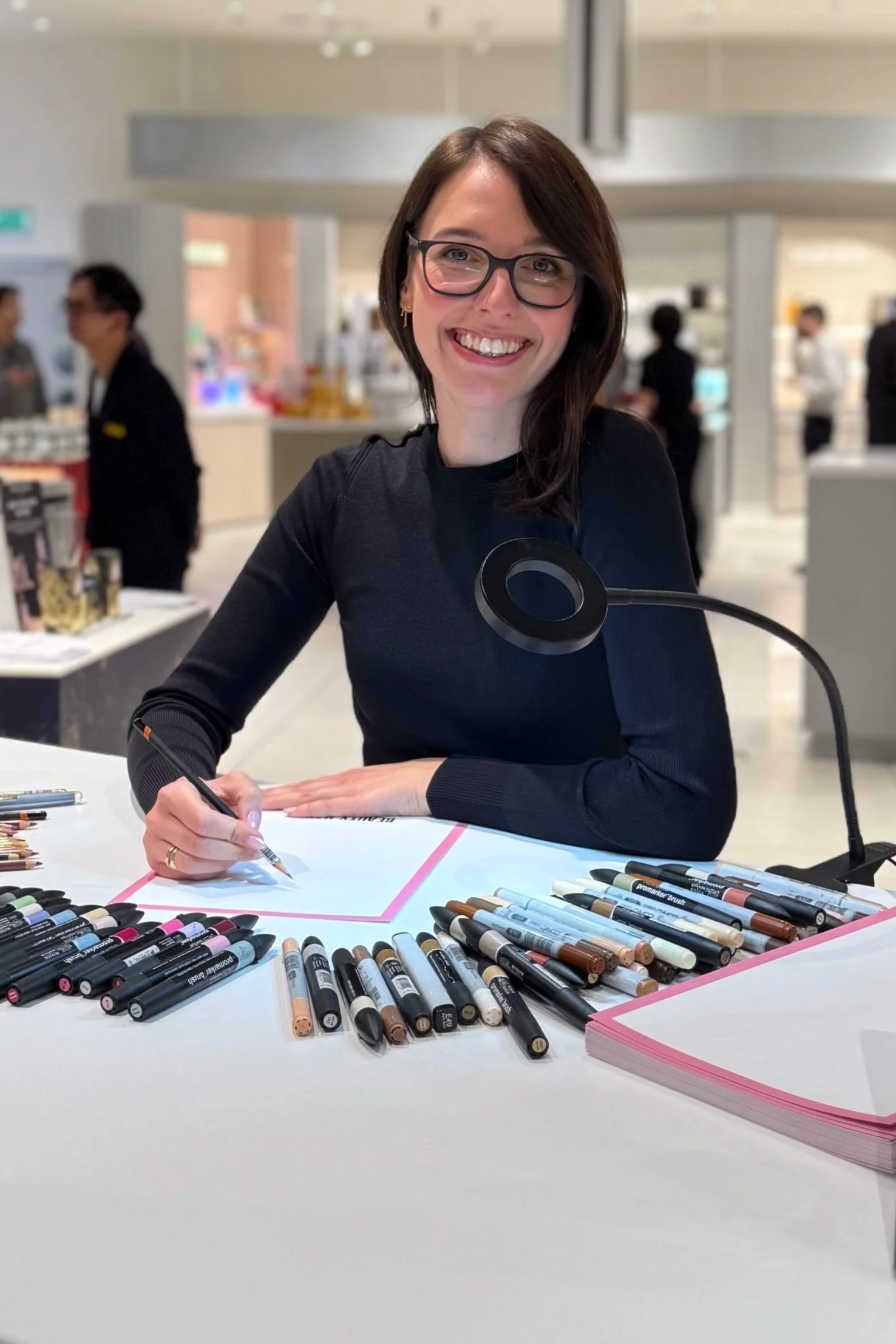 Live fashion illustrator at an instore event for a new beauty hall opening. Ready to illustrate the guests.