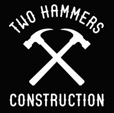 Two hammers icons crossed with the business name writing around logo mark the reading Two Hammers Construction