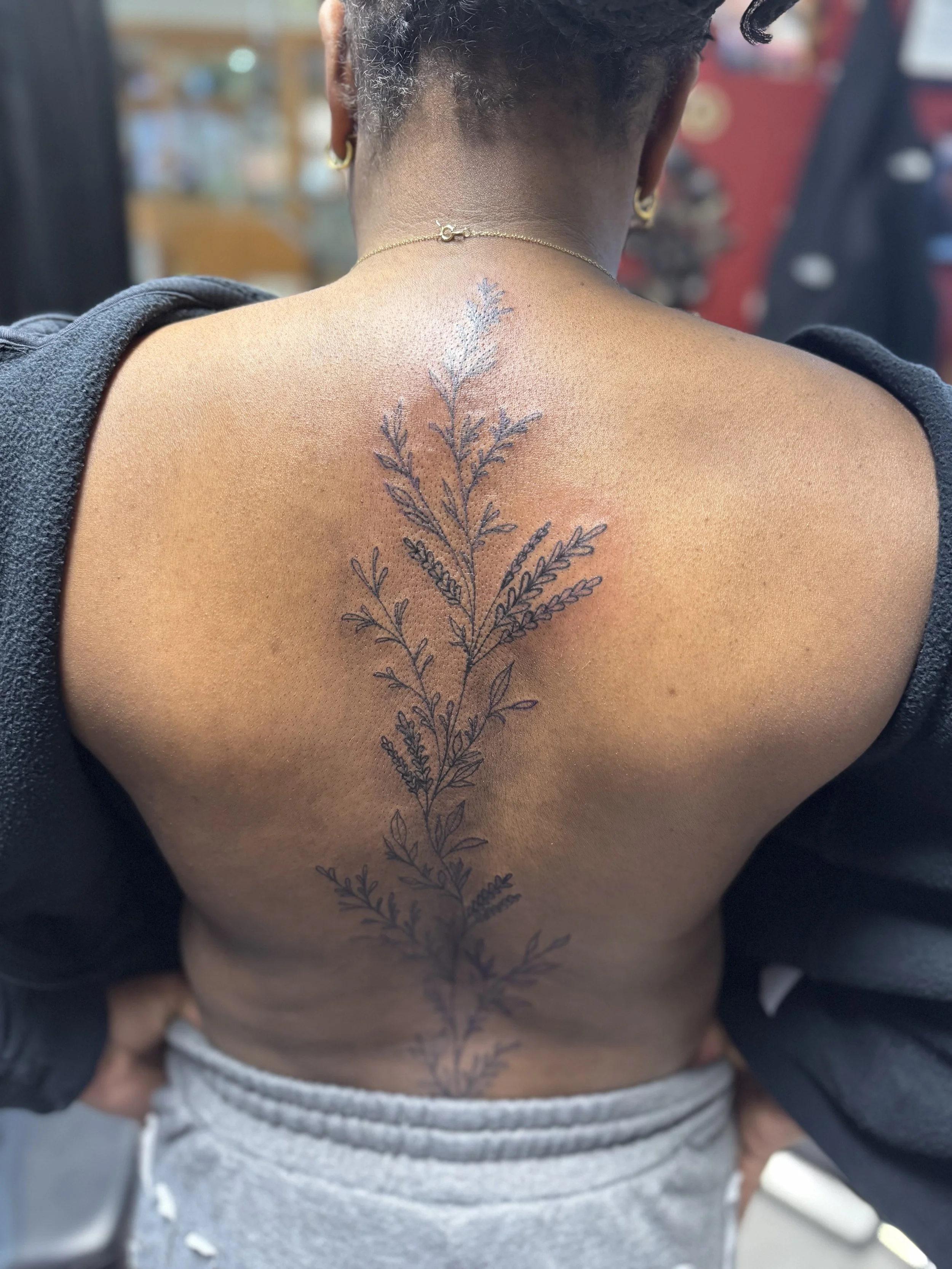 Fine line leafy spine piece 1.jpeg