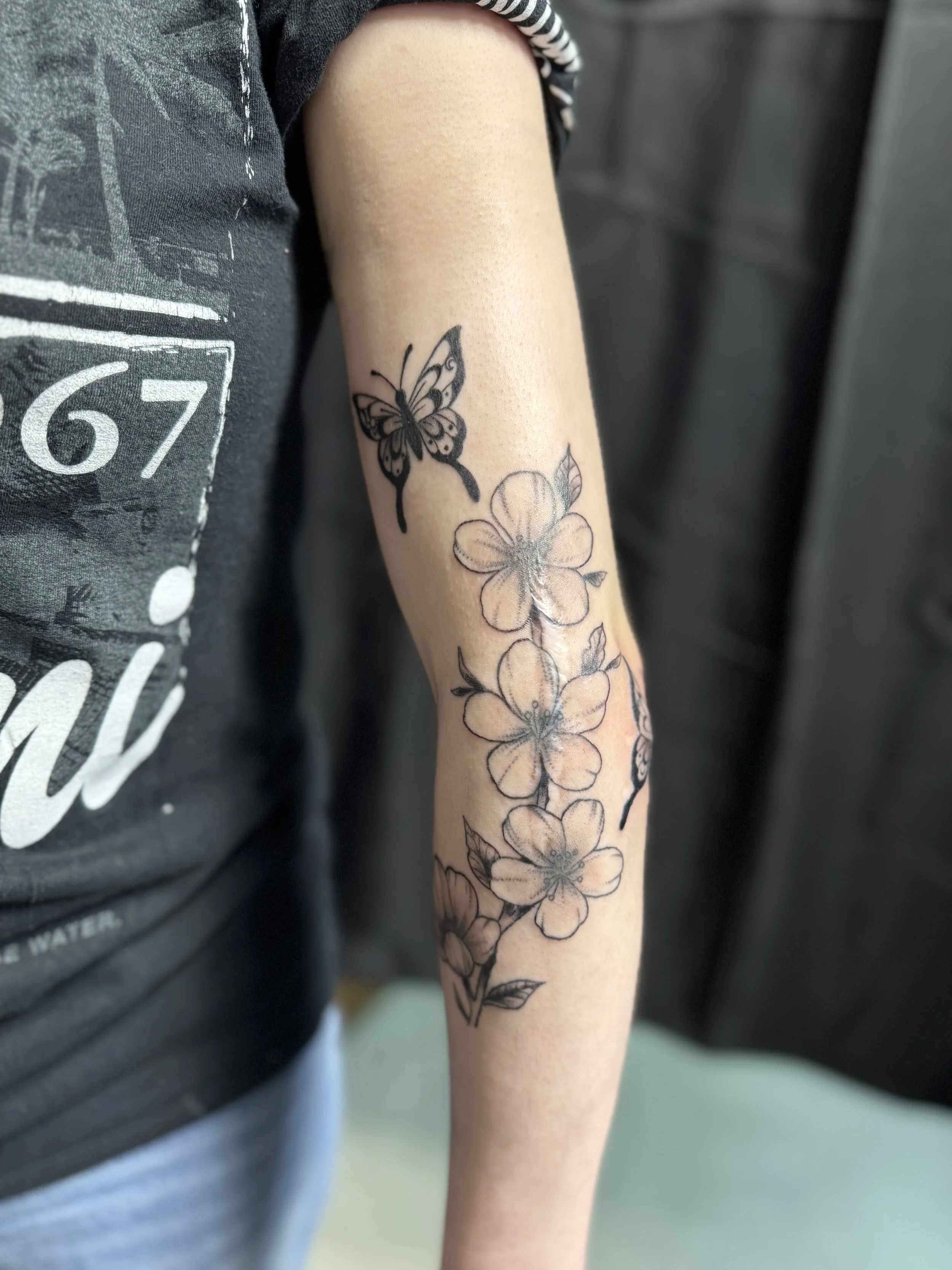 BG cherry blossoms with x2 butterflies on arm 2.jpeg