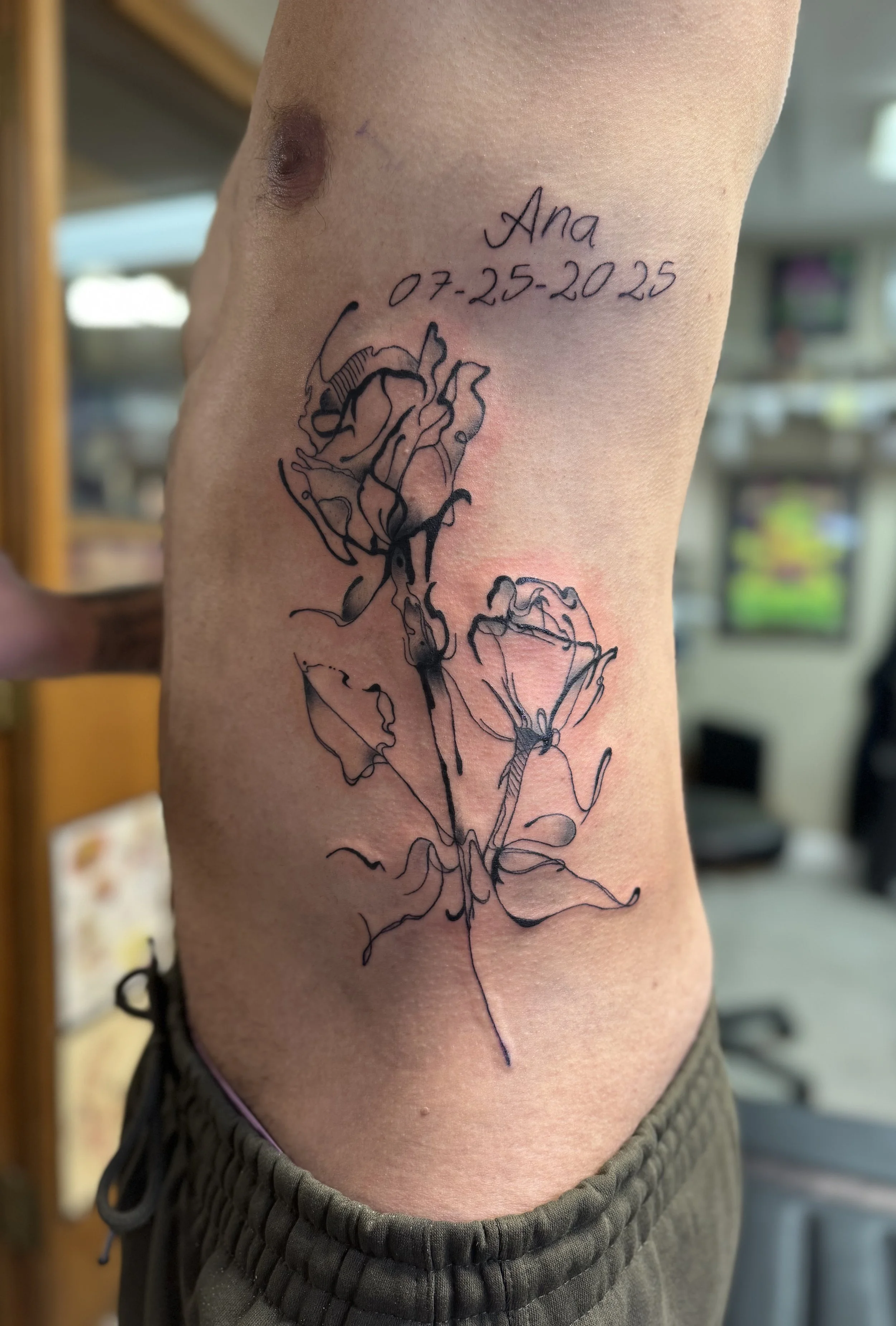 Wispy roses on side.jpeg