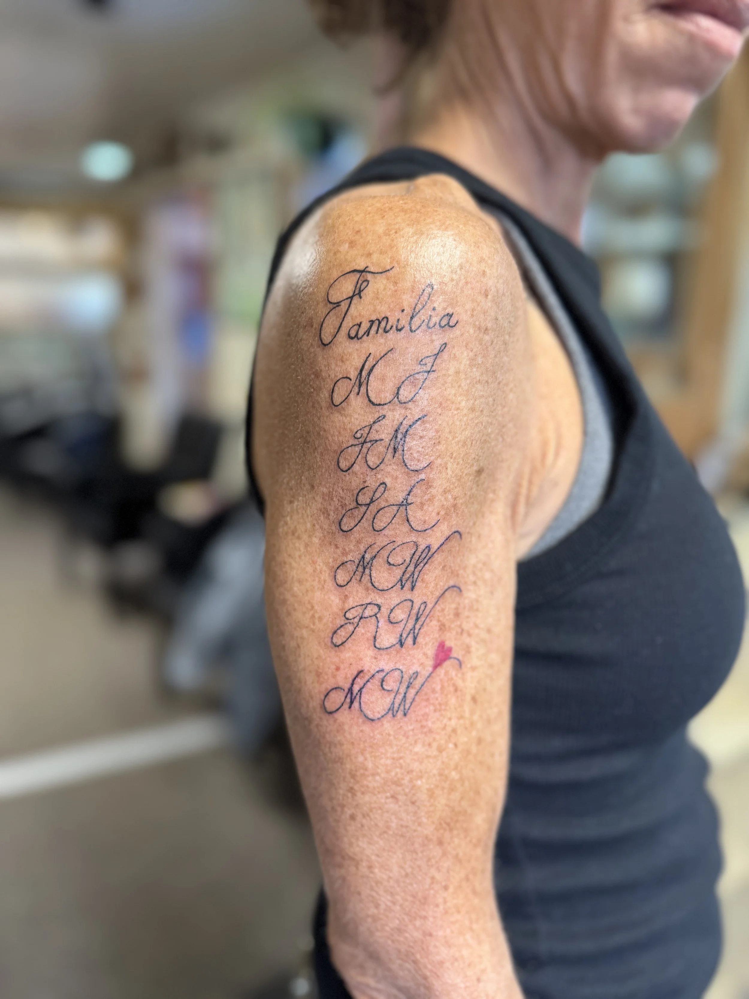 Names down arm with heart.jpeg