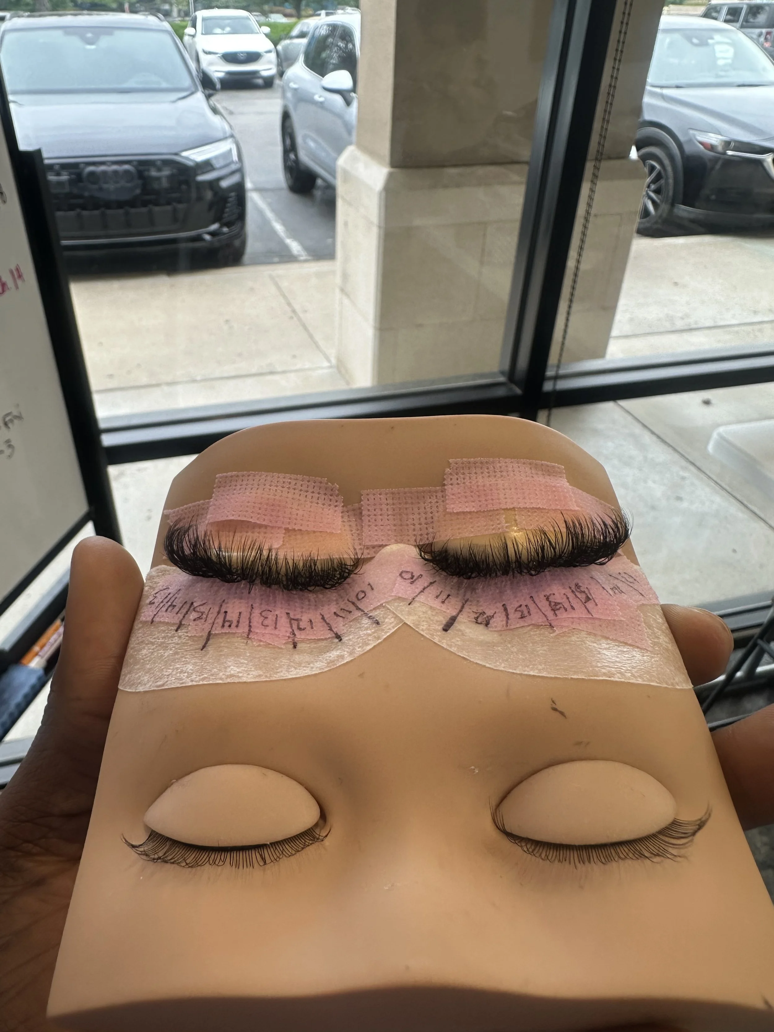 practicing lashes on mannequin 