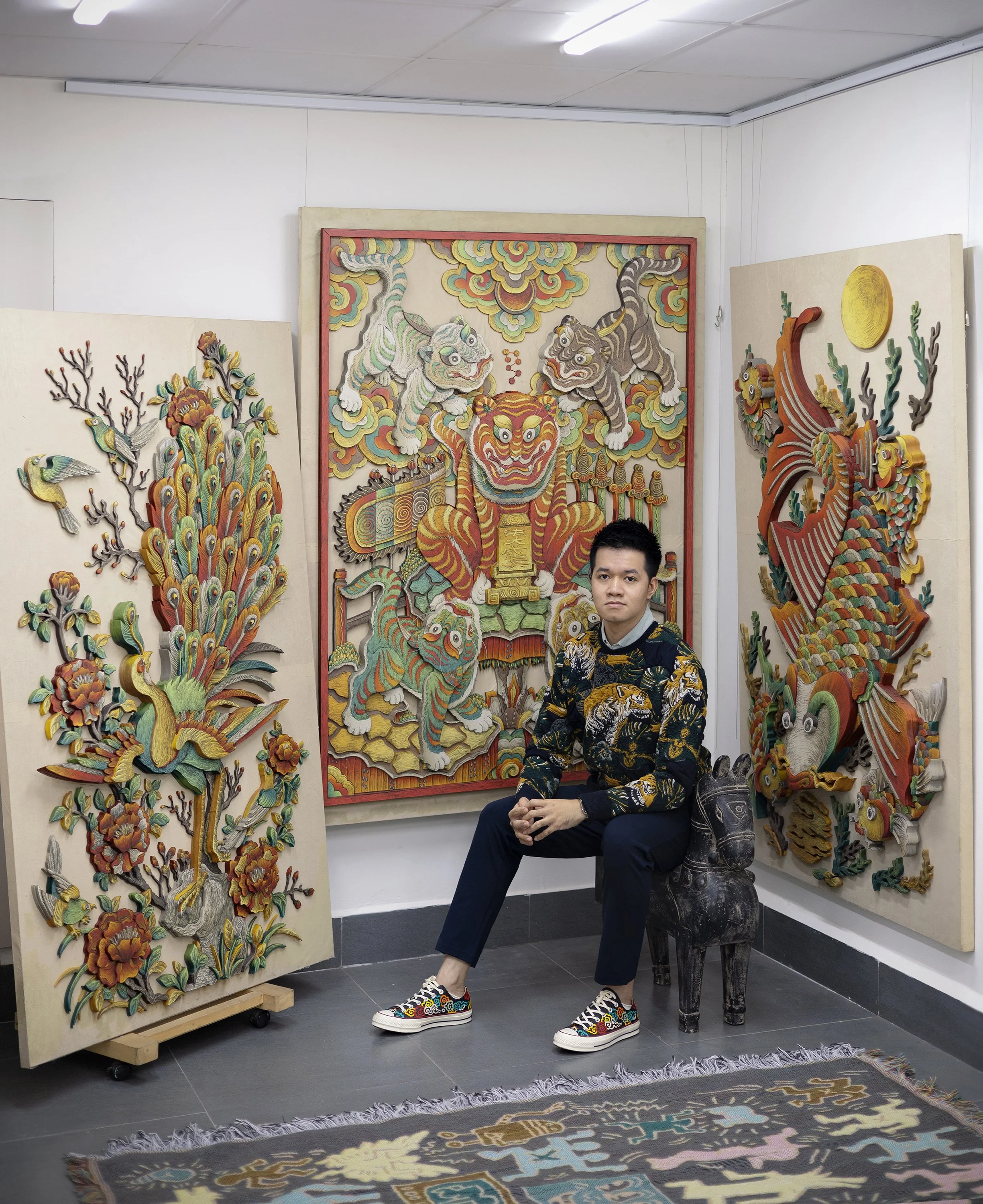 Artist Xuân Lam and his folk painting remakes. Image courtesy of the artist.