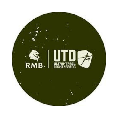 Green circular logo with white text and graphics for UML Ulta-Trail Dragensberg, featuring a bear paw, a skier, and a bear head.