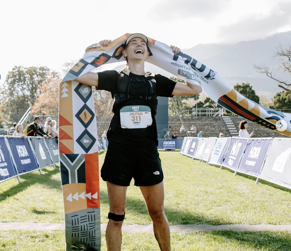 Emily Djock, finishing 1st in the 100km MUT by UTMB trail running race in 2025 in George South Africa as a Flat Rock Athlete. 