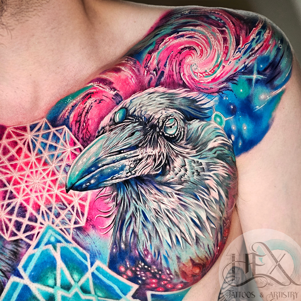 Colorful tattoo of a raven with a cosmic background and geometric patterns on a person’s shoulder.