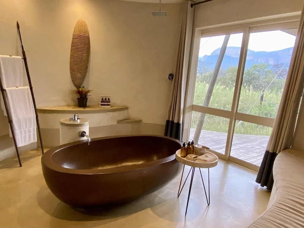 bathtub and mountain view at marataba safari lodge