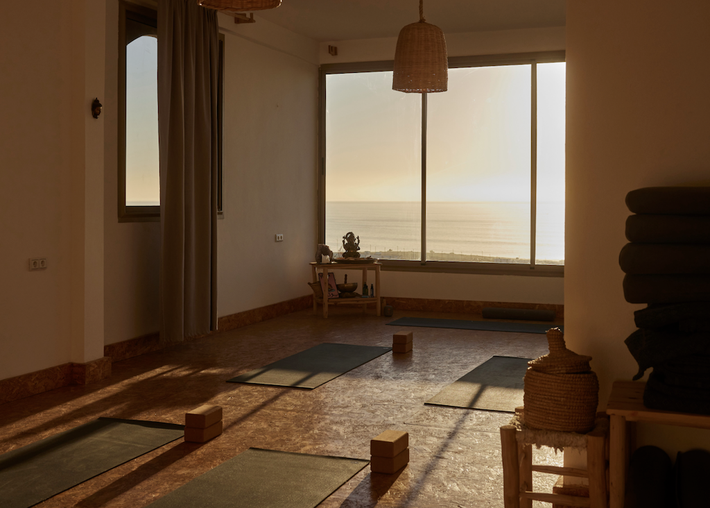 Yoga studio with mats and props taken at sunset