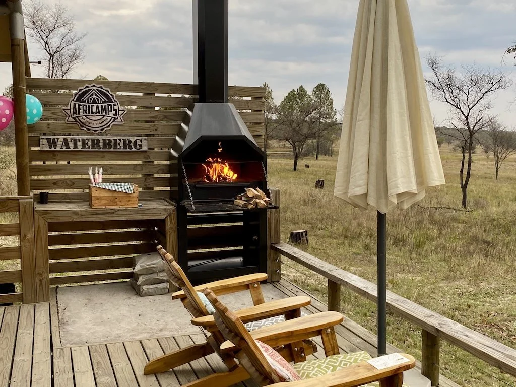 Africamps glamping deck with fire lit