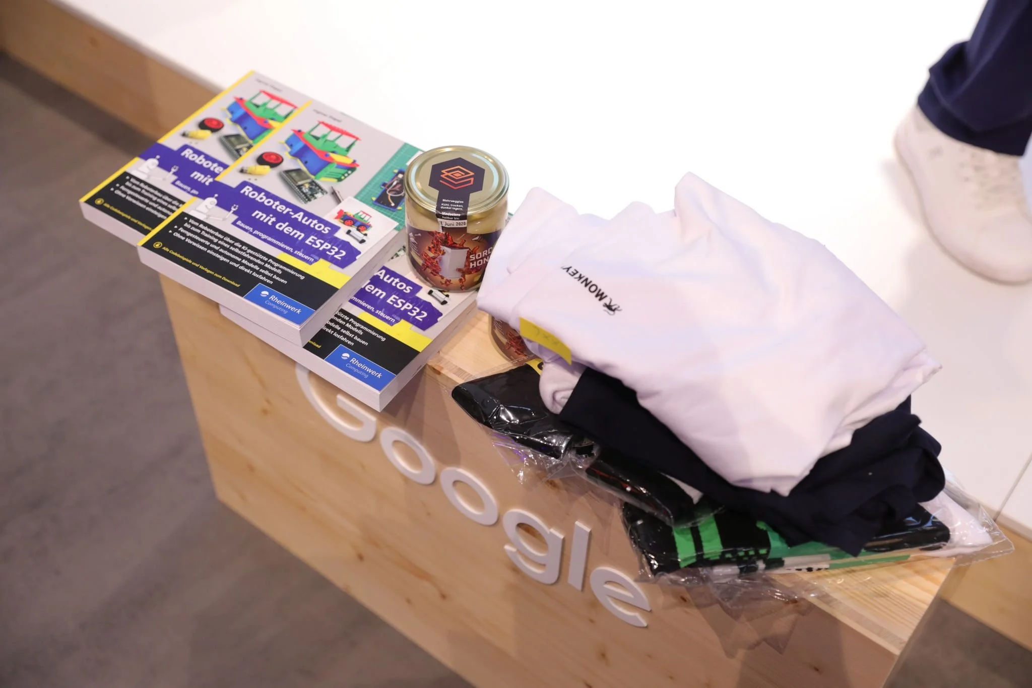 Great gifts offered during SORDI.ai's IAA Mobility 2025 presentation, including Ingmar STAPEL's latest robotic book, SORDI.ai Honey jars, and Monkeyway gifts