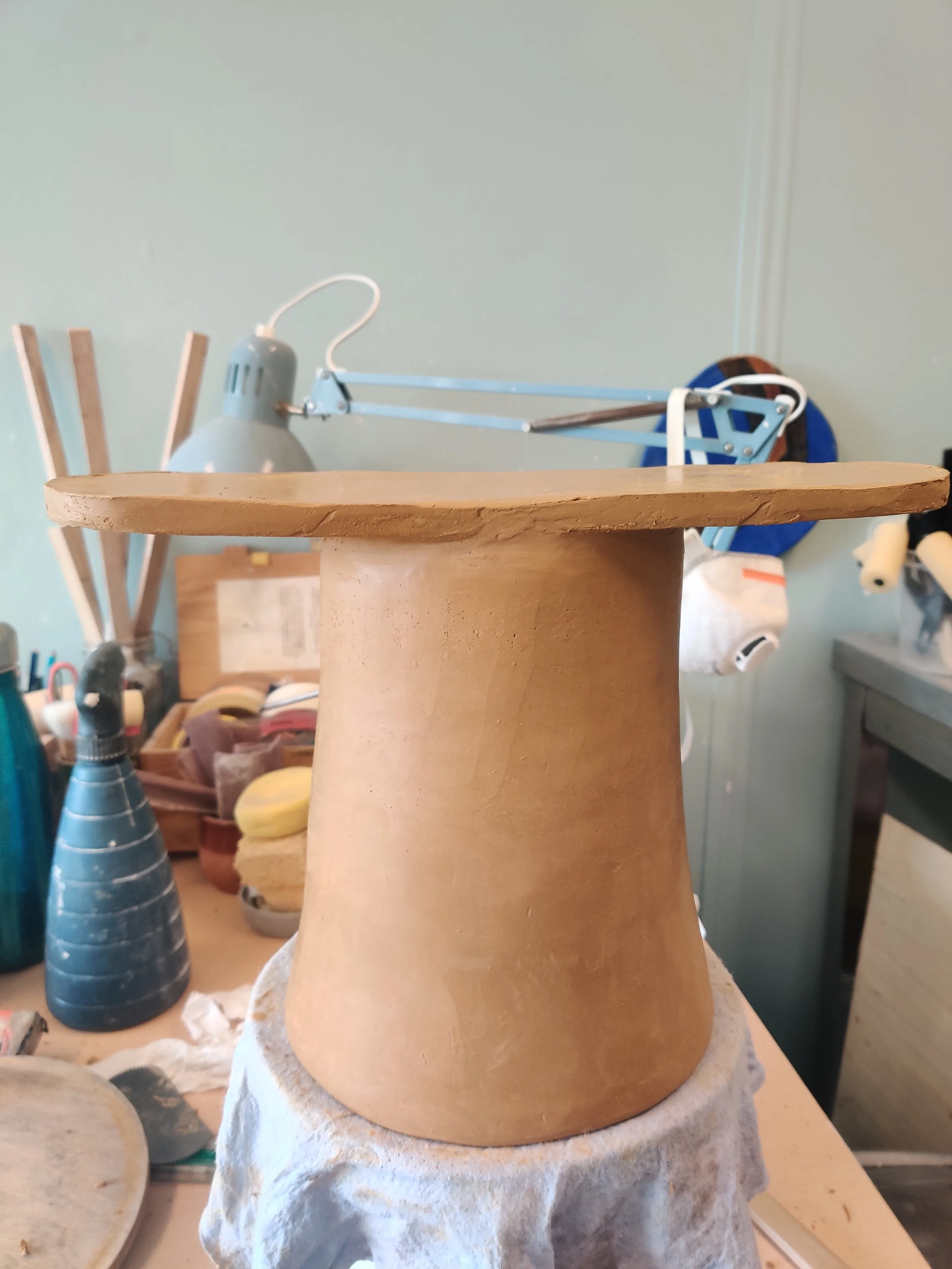 making of red clay stool